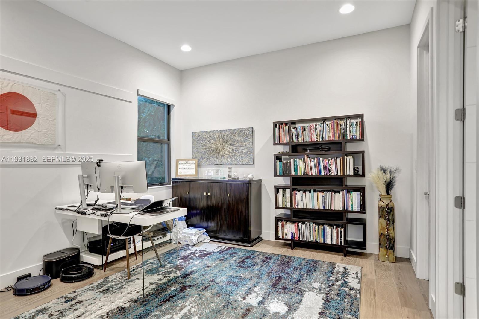 17113 Aquavera Way Boca Raton, FL 33496 - Photo 63 of 84 a workspace with furniture and book shelf