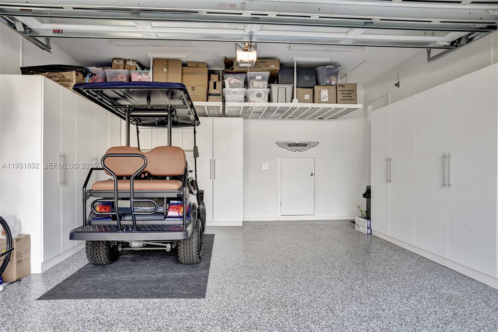 17113 Aquavera Way Boca Raton, FL 33496 - Photo 65 of 84 a view of a room with racks on the wall