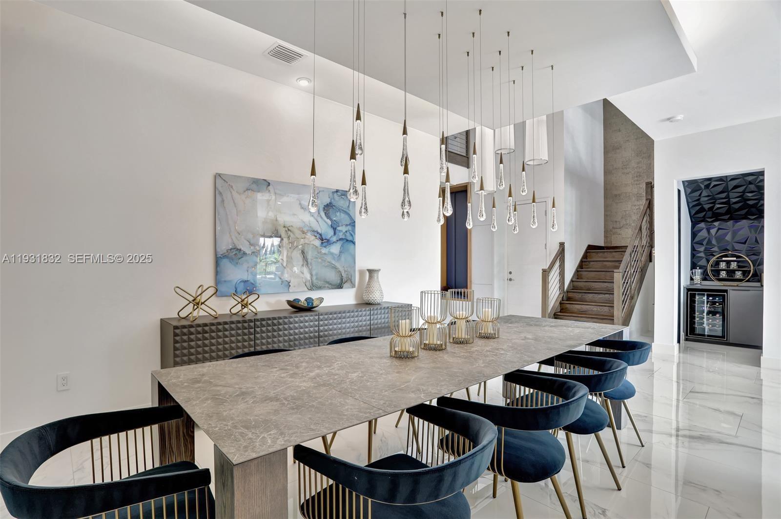 17113 Aquavera Way Boca Raton, FL 33496 - Photo 10 of 84 a view of a dining room with furniture and wooden floor