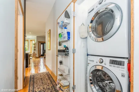 a view of a hallway with washer and dryer