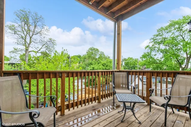 a view of a balcony with wooden floor