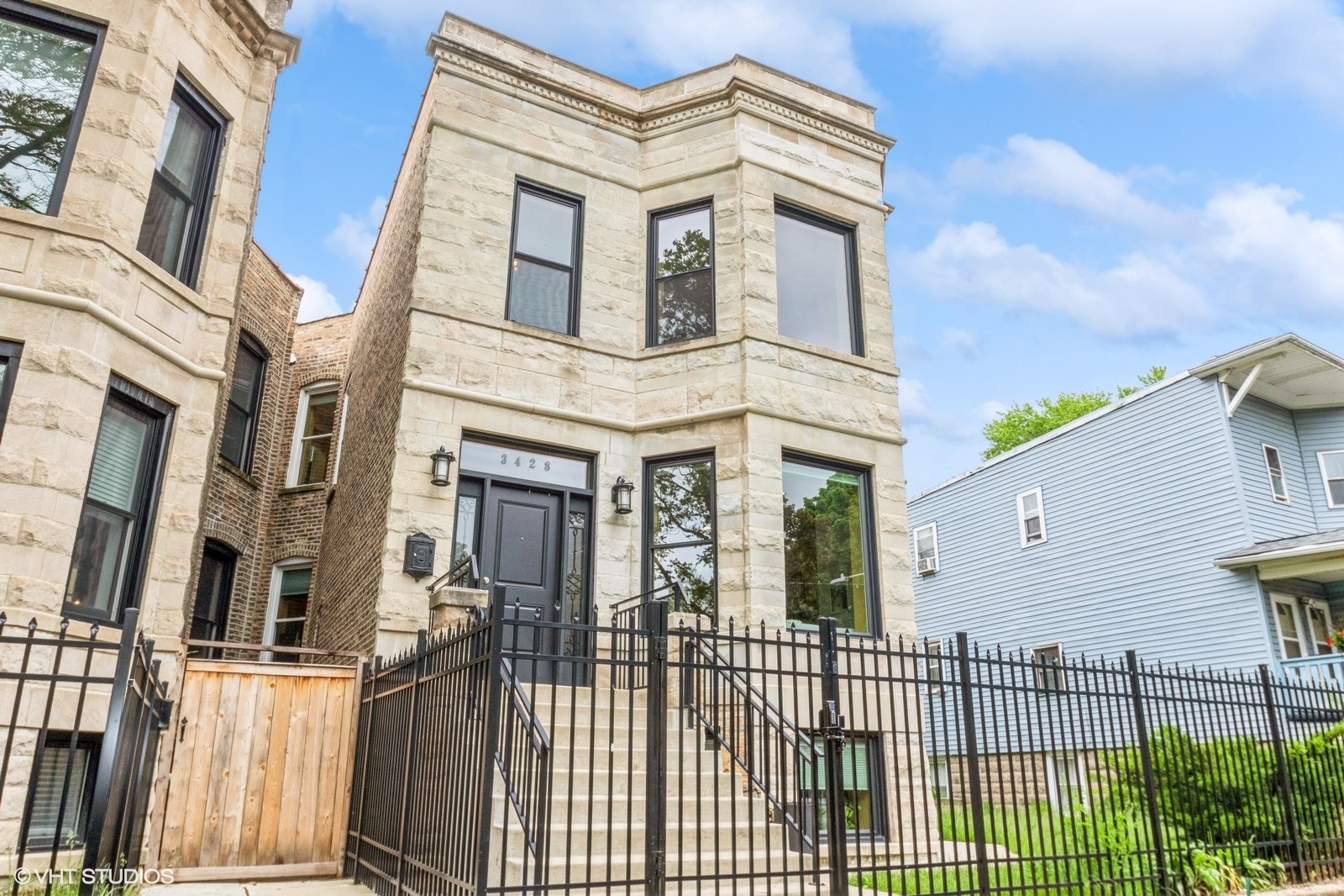 3428 West Belden Avenue, Unit 1 Chicago, IL 60647 - Photo 2 of 19 a view of a brick house with large windows