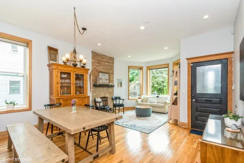 a living room with a table or chairs and a wooden floor