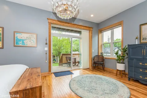 a bedroom with furniture and a window