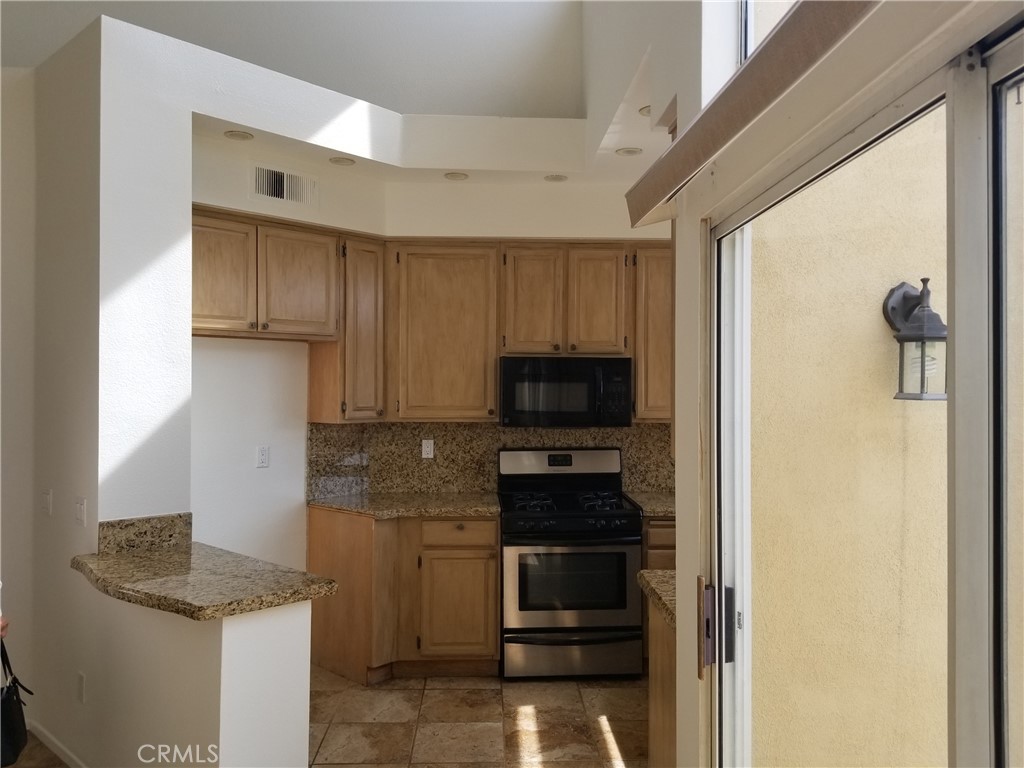 28225 Via Fierro Laguna Niguel, CA 92677 - Photo 11 of 70 a kitchen with a sink a stove and refrigerator