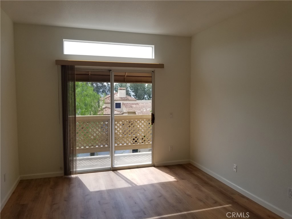 28225 Via Fierro Laguna Niguel, CA 92677 - Photo 12 of 70 a view of an empty room with wooden floor and a window