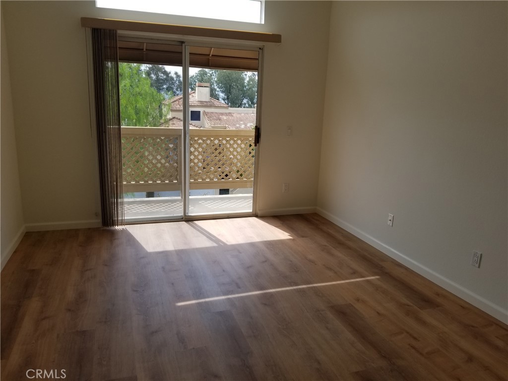 28225 Via Fierro Laguna Niguel, CA 92677 - Photo 21 of 70 an empty room with wooden floor and windows