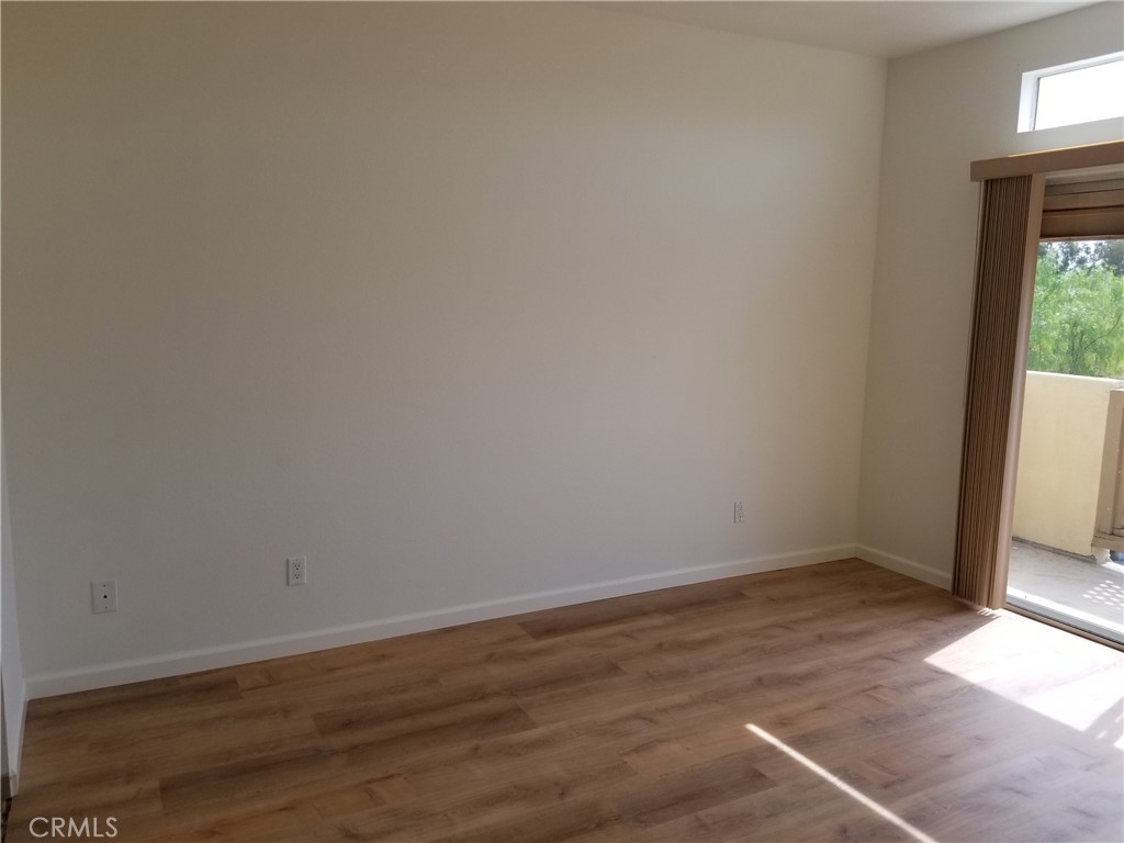 28225 Via Fierro Laguna Niguel, CA 92677 - Photo 23 of 70 a view of an empty room with wooden floor and a window