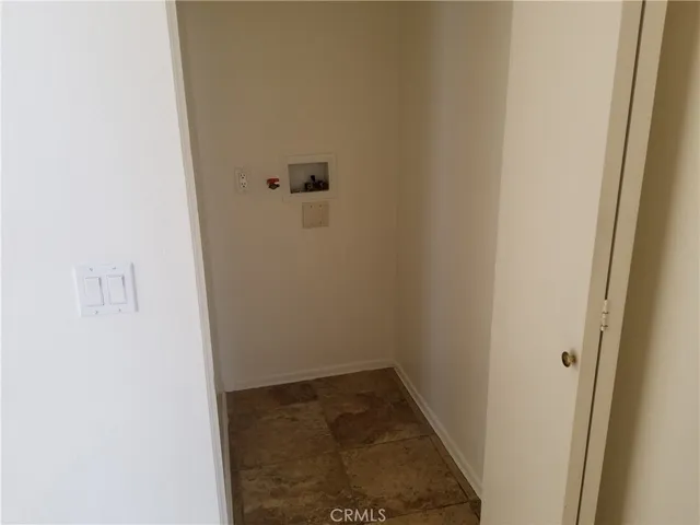 a kitchen with granite countertop a sink and steel appliances