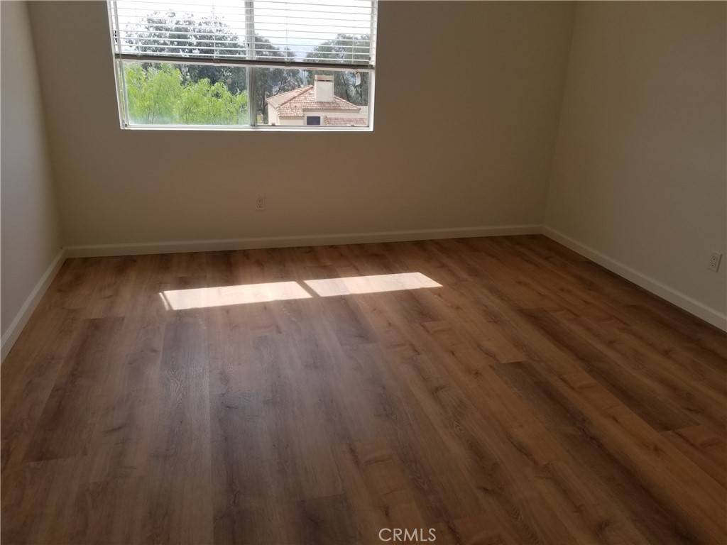 28225 Via Fierro Laguna Niguel, CA 92677 - Photo 28 of 70 an empty room with wooden floor and windows