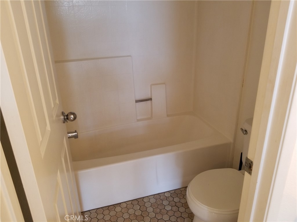 28225 Via Fierro Laguna Niguel, CA 92677 - Photo 55 of 70 a white toilet sitting next to a bath tub