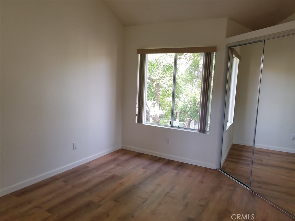 28225 Via Fierro Laguna Niguel, CA 92677 - Photo 57 of 70 an empty room with wooden floor and windows