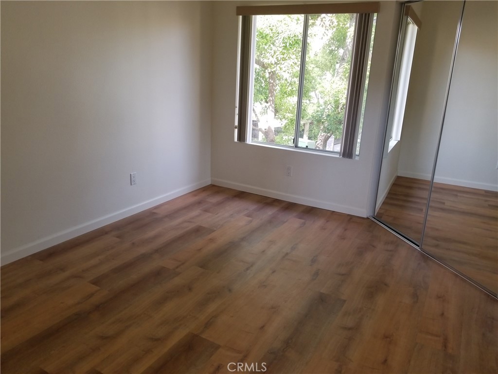 28225 Via Fierro Laguna Niguel, CA 92677 - Photo 58 of 70 a view of an empty room with wooden floor and a window