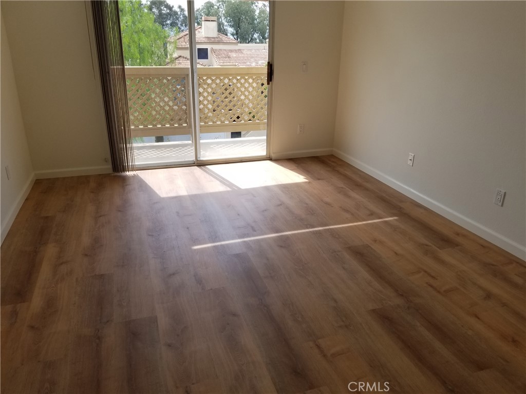 28225 Via Fierro Laguna Niguel, CA 92677 - Photo 61 of 70 a view of a room with wooden floor and sliding door