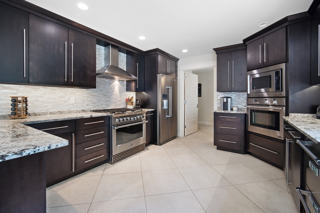 2 Nikkis Way Hadley, MA 01035 - Photo 15 of 40 a kitchen with stainless steel appliances and cabinets