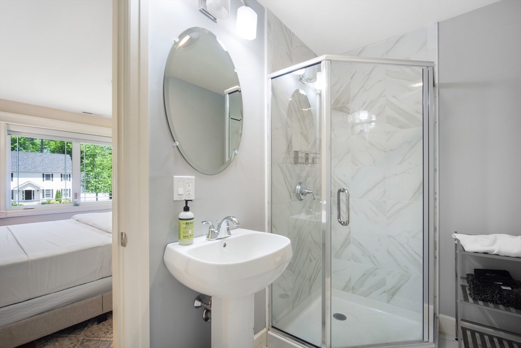 2 Nikkis Way Hadley, MA 01035 - Photo 28 of 40 a bathroom with a sink mirror and shower