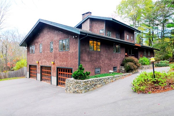 3 Bridge Street Dover, MA 02030 - Photo 1 of 15 a front view of a house with a yard and garage