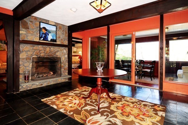 3 Bridge Street Dover, MA 02030 - Photo 3 of 15 a living room with furniture a rug and a fireplace