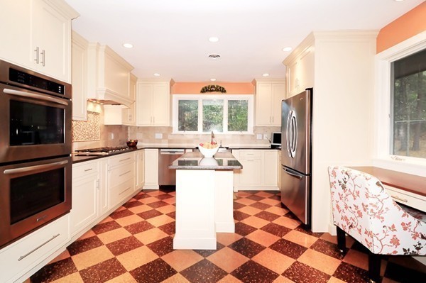 3 Bridge Street Dover, MA 02030 - Photo 7 of 15 a kitchen with stainless steel appliances a stove a sink and a refrigerator