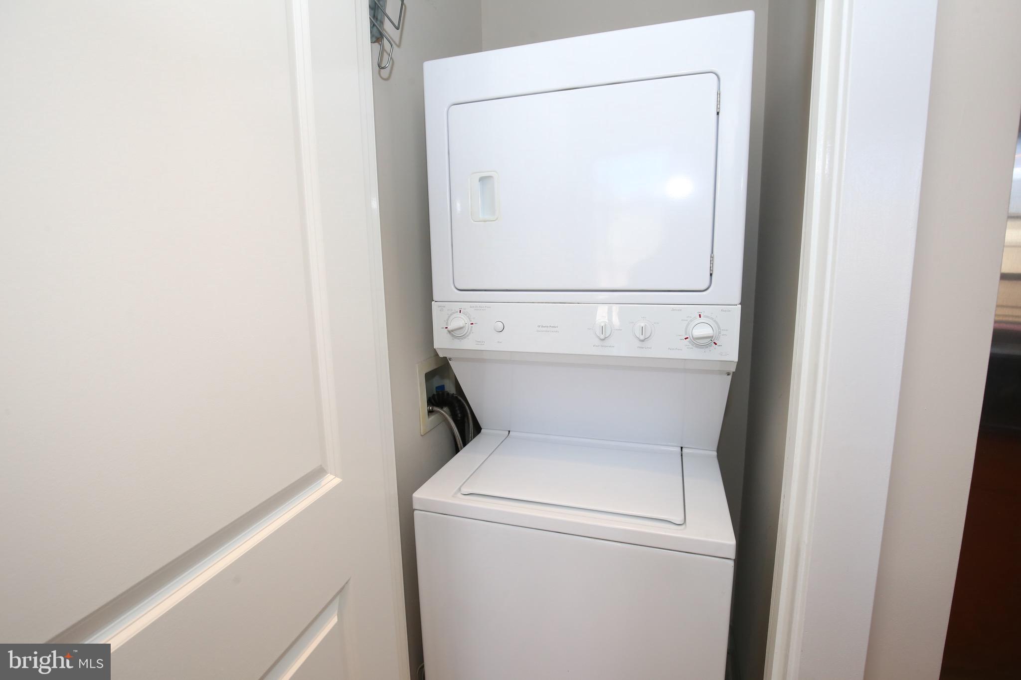 2421 18th Street Northwest, Unit 302 Washington, DC 20009 - Photo 16 of 30 a utility room with dryer and washer