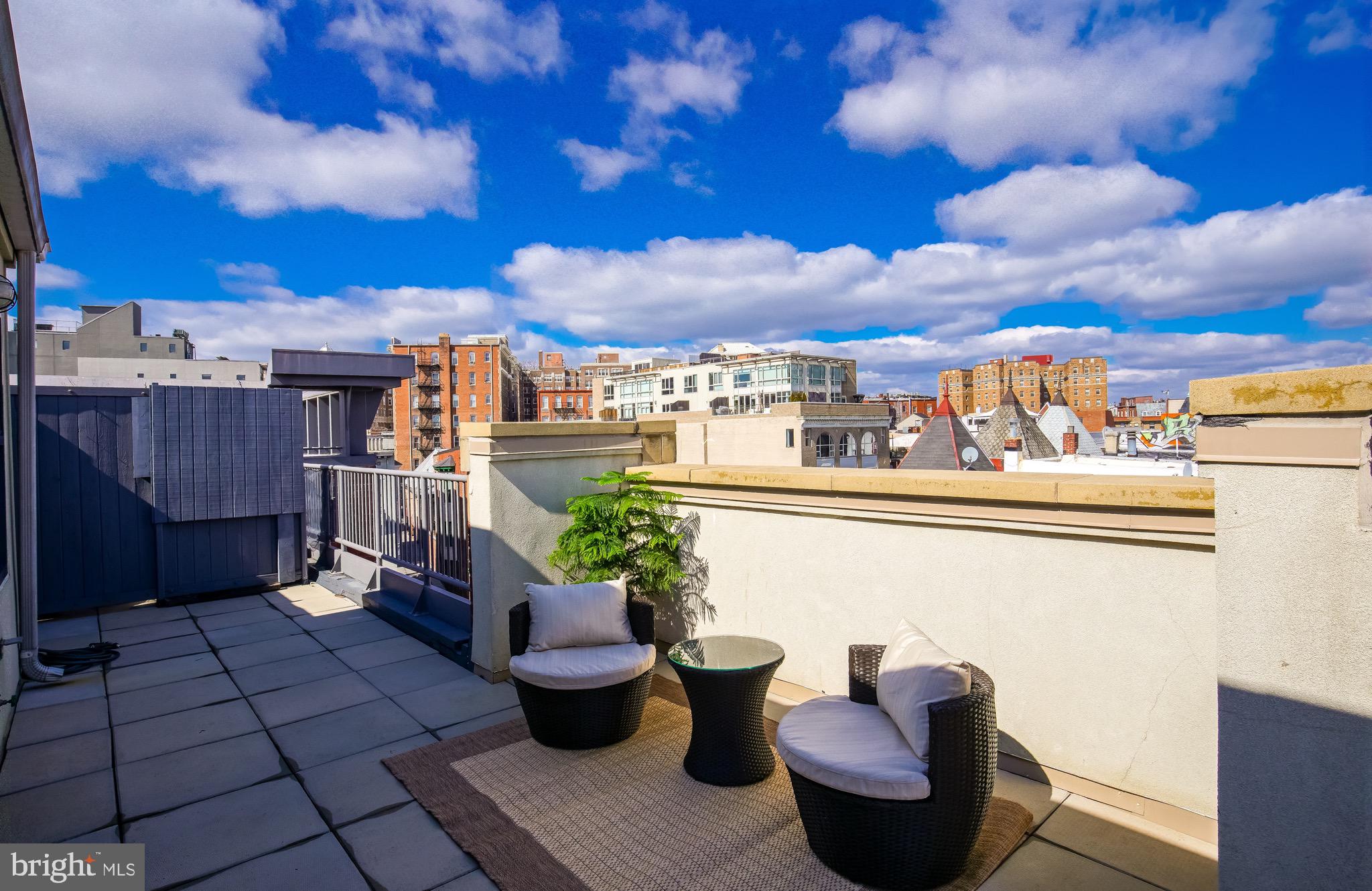 2421 18th Street Northwest, Unit 302 Washington, DC 20009 - Photo 24 of 30 a view of a terrace with furniture