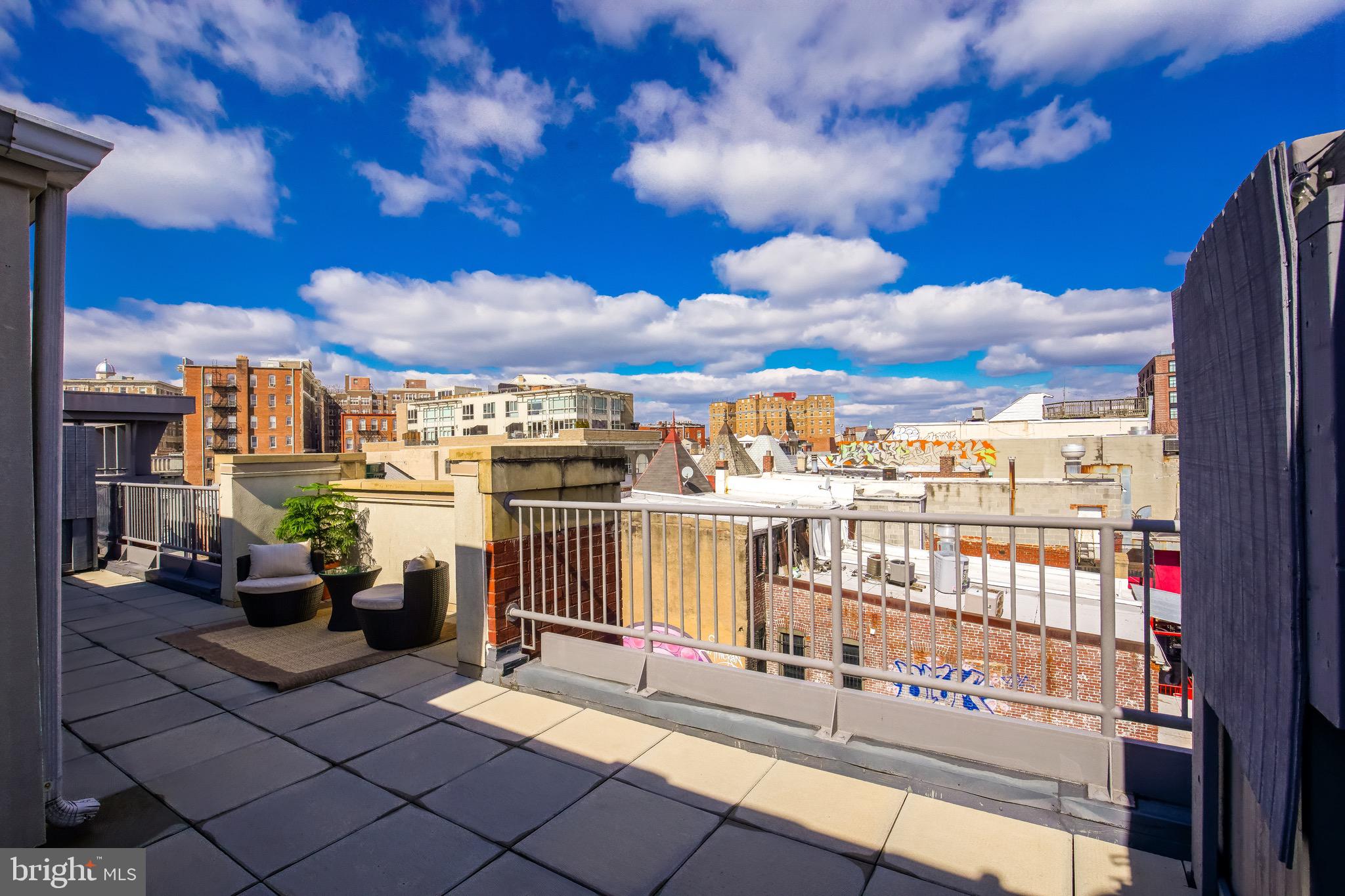 2421 18th Street Northwest, Unit 302 Washington, DC 20009 - Photo 25 of 30 a view of a terrace with lawn chairs