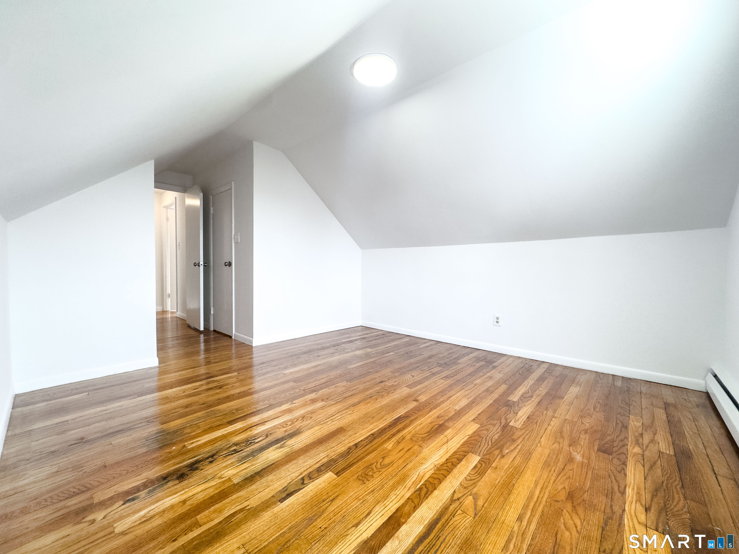 106 Augusta Street Watertown, CT 06779 - Photo 13 of 28 a view of empty room with wooden floor
