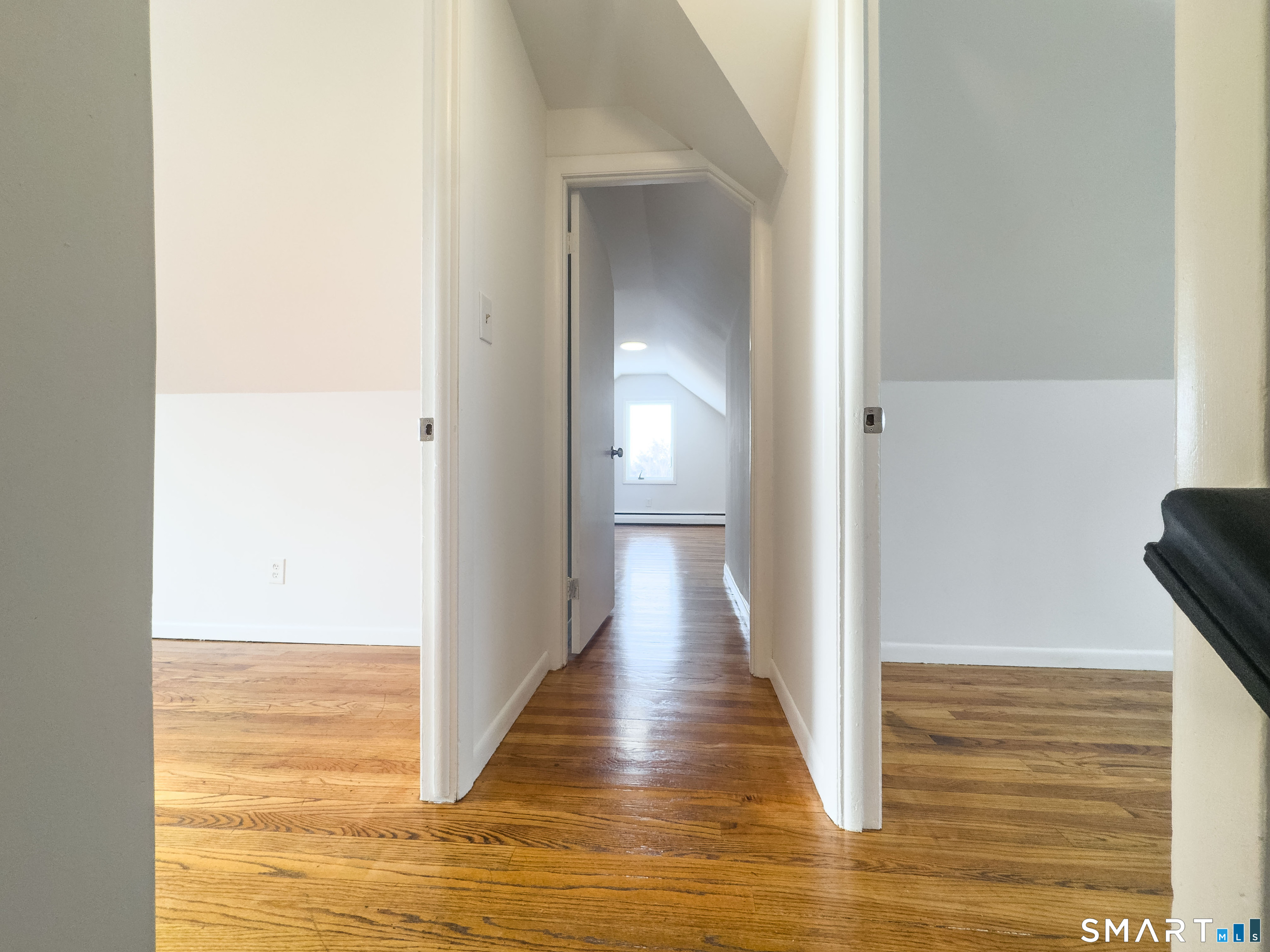 106 Augusta Street Watertown, CT 06779 - Photo 14 of 28 a view of a hallway with wooden floor