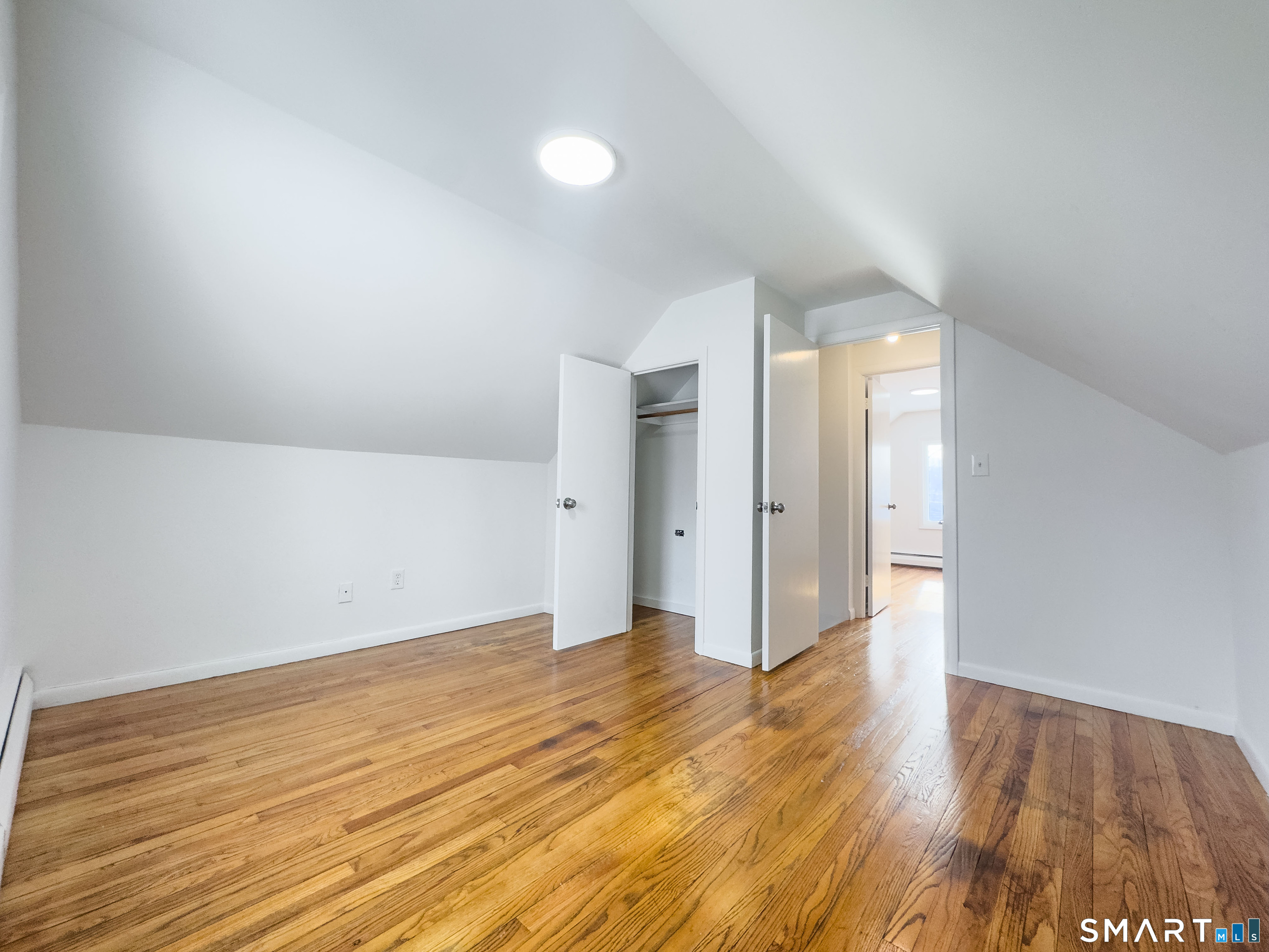 106 Augusta Street Watertown, CT 06779 - Photo 15 of 28 a view of an empty room and wooden floor