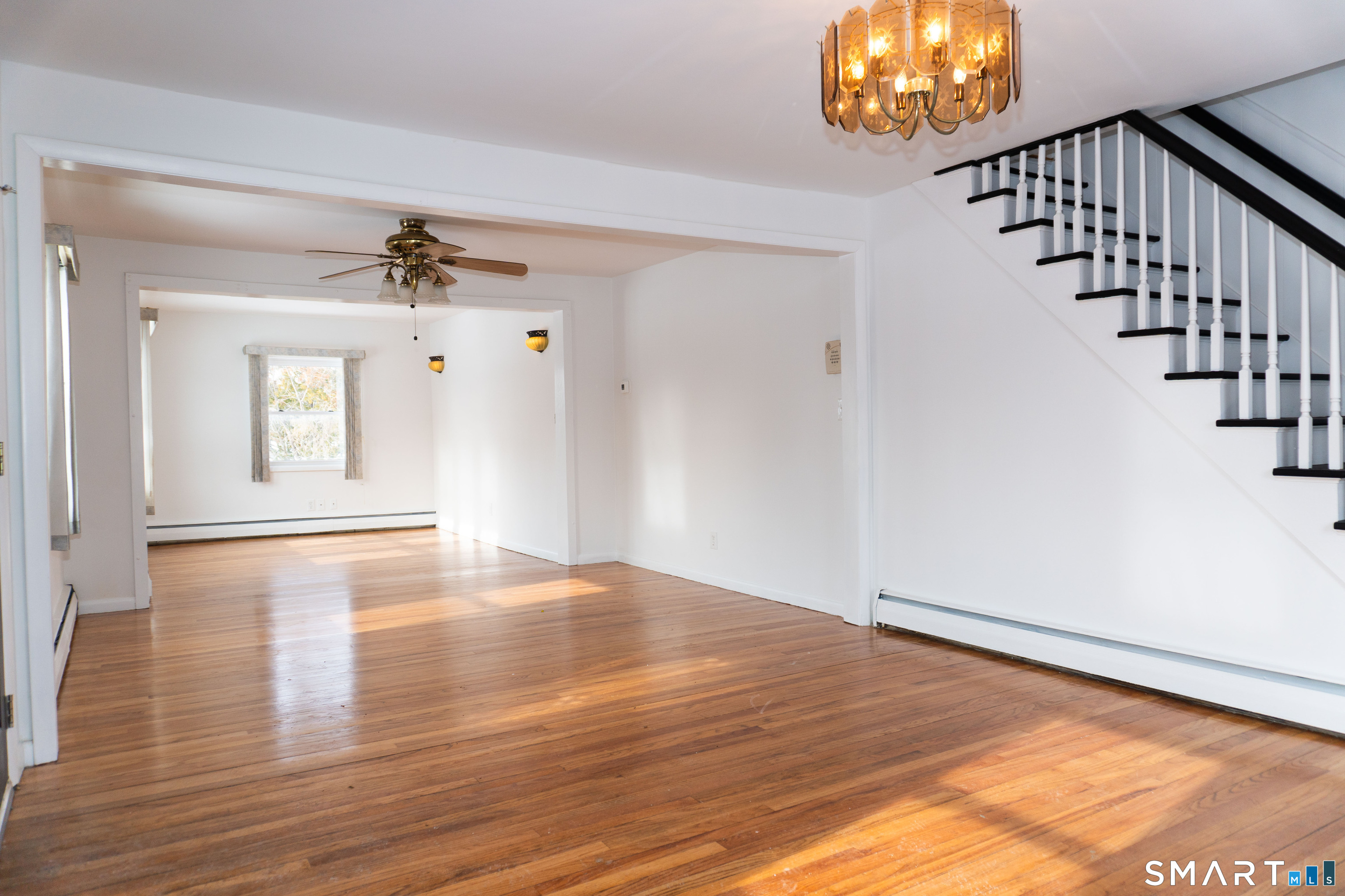 106 Augusta Street Watertown, CT 06779 - Photo 4 of 28 a view of an empty room and wooden floor