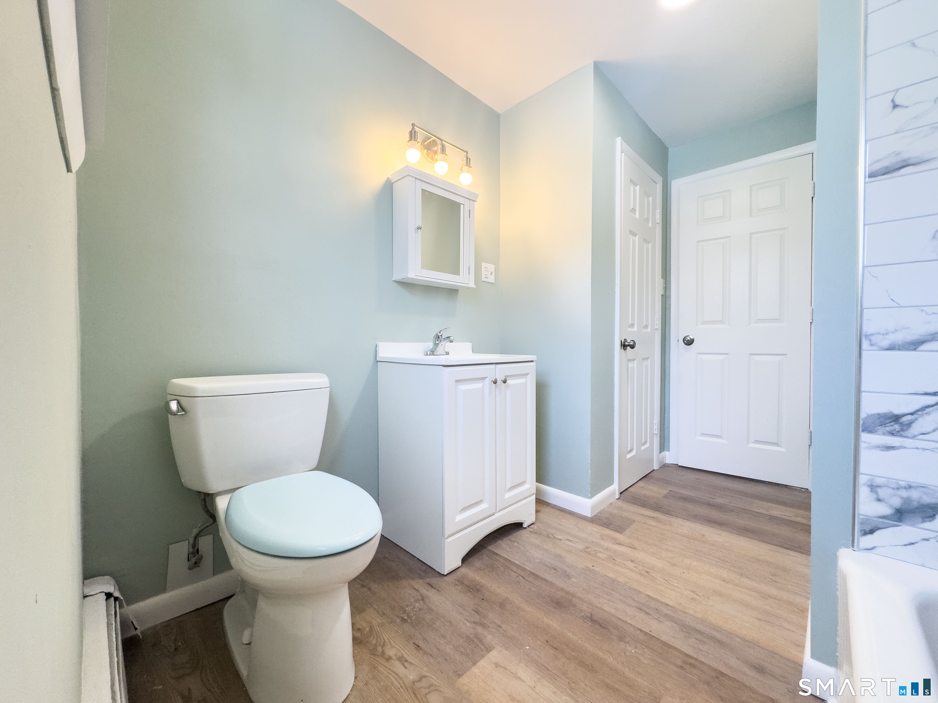 106 Augusta Street Watertown, CT 06779 - Photo 9 of 28 a bathroom with a toilet and a sink