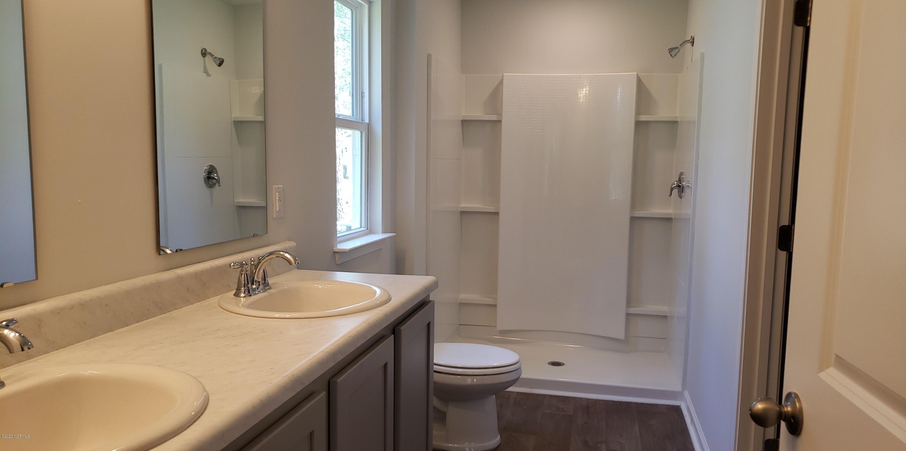 411 Ellis Road Southeast, Unit LOT #34 Bolivia, NC 28422 - Photo 3 of 46 Actual Home Photo. Master bath
