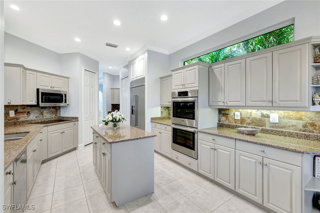 2450 Wulfert Road Sanibel, FL 33957 - Photo 19 of 44 a kitchen with a sink stove and microwave