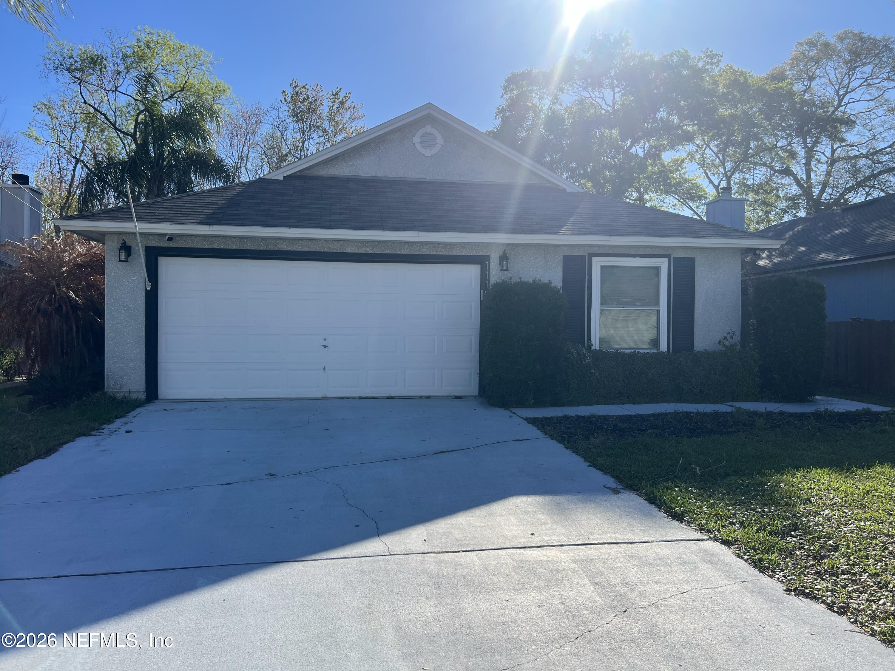 1115 Main Street Atlantic Beach, FL 32233 - Photo 1 of 14 a view of backyard and garage