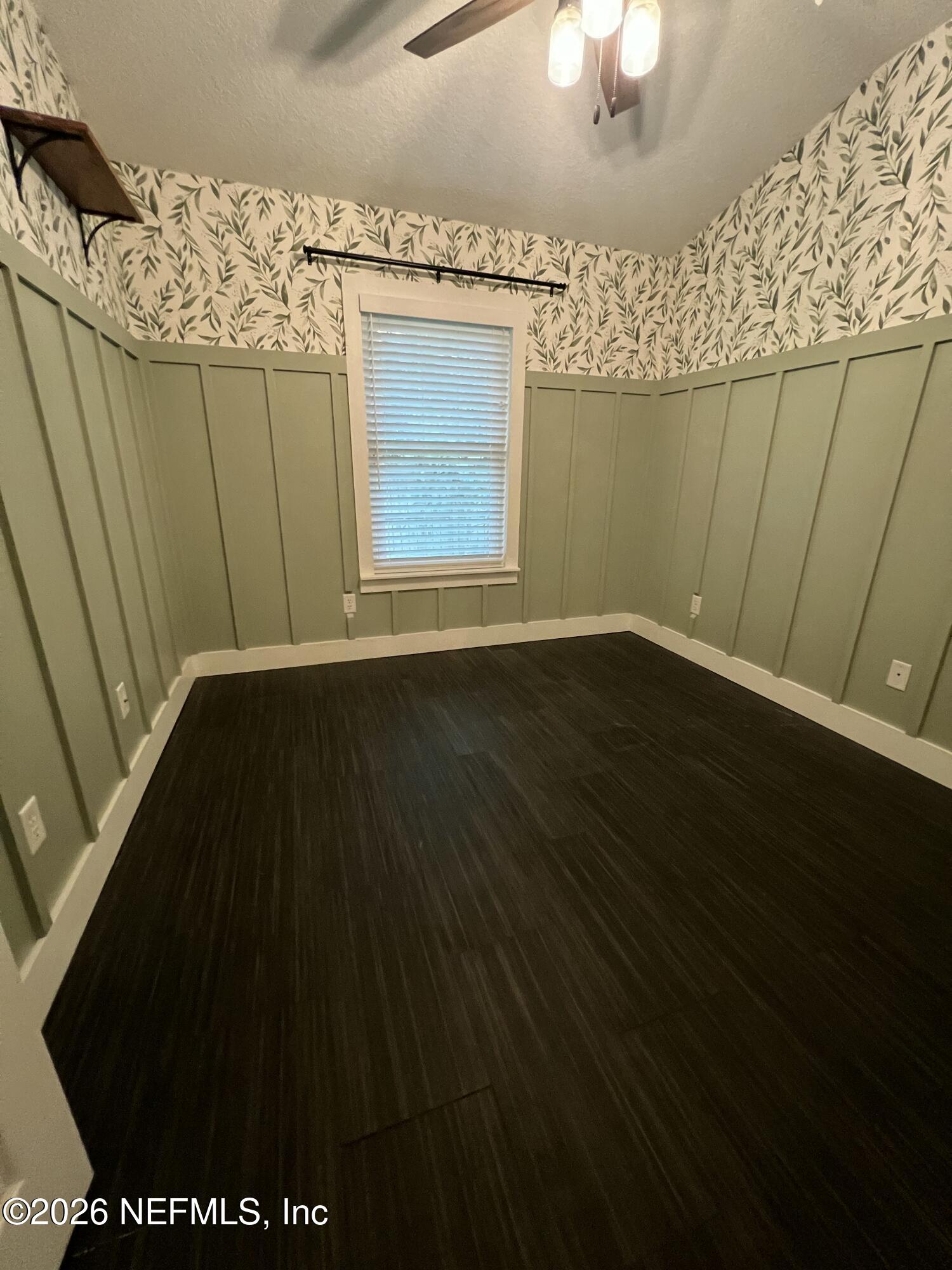 1115 Main Street Atlantic Beach, FL 32233 - Photo 12 of 14 a view of wooden floor and a chandelier fan in a room