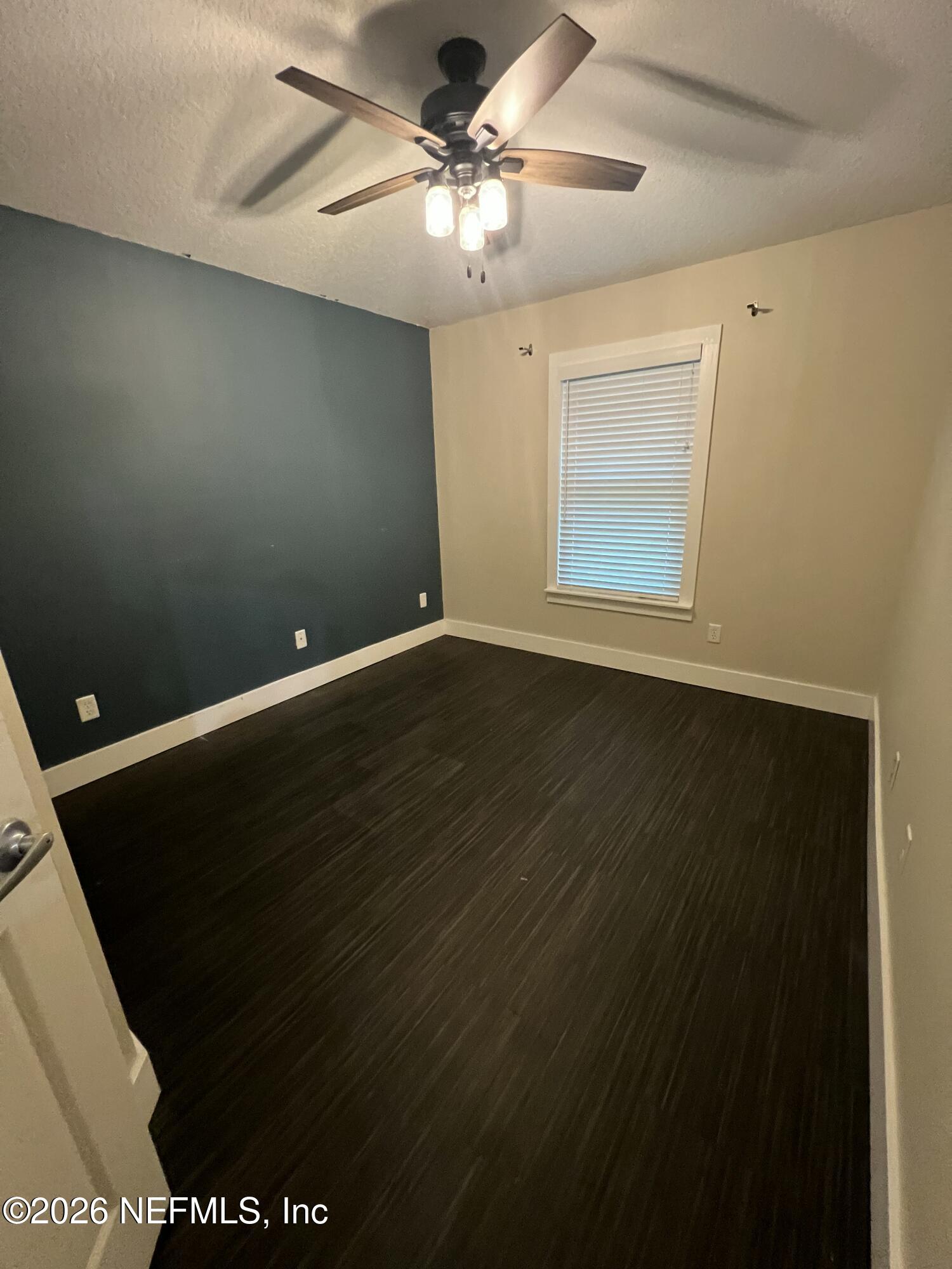 1115 Main Street Atlantic Beach, FL 32233 - Photo 13 of 14 a view of an empty room with a window