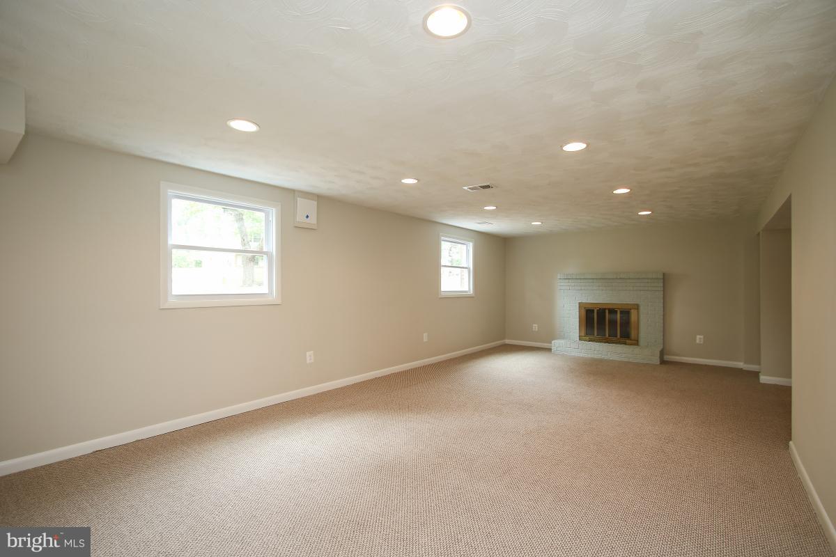 6903 Presley Road Lanham, MD 20706 - Photo 19 of 28 an empty room with a empty space and windows