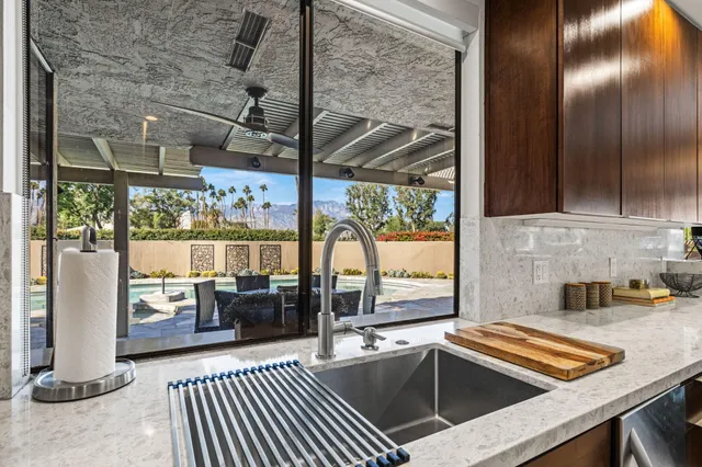 a kitchen that has a sink and a stove