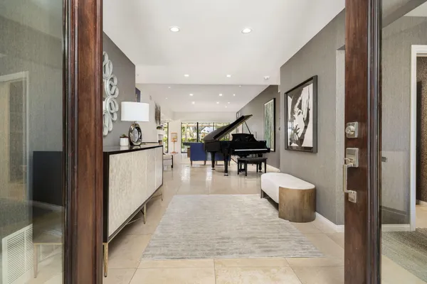 a lobby with furniture and a potted plant