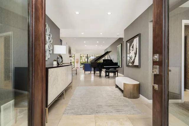 a lobby with furniture and a potted plant