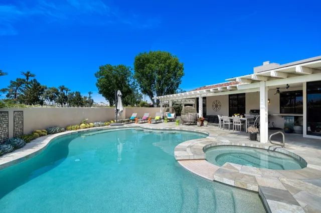 a view of a swimming pool with a patio