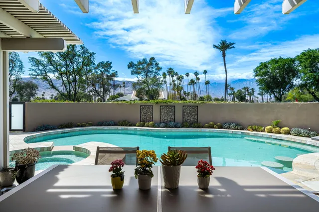 a view of a golf course with chairs