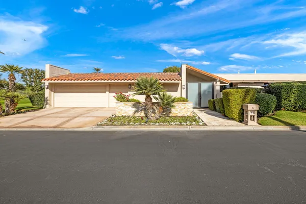 a view of a house with a street