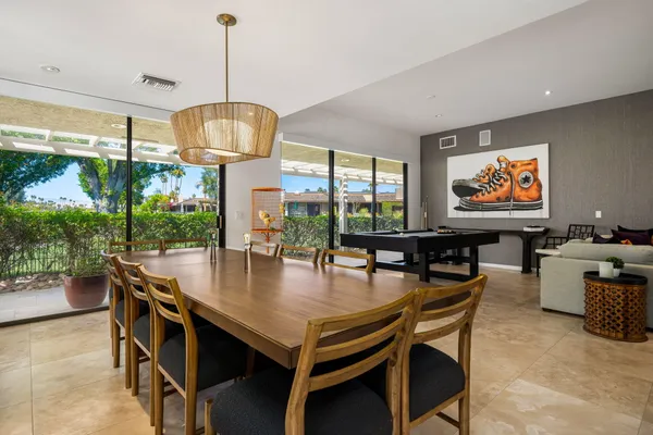 a view of a dining room with furniture window and outside view