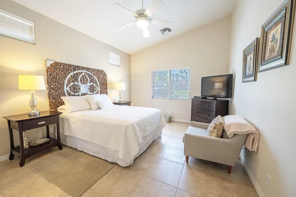 a spacious bathroom with double vanity and a bathtub