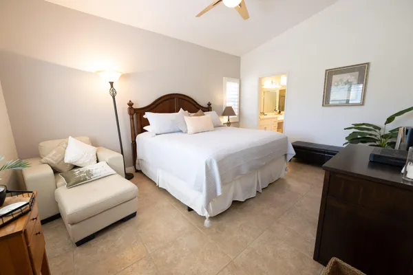 a spacious bathroom with a double vanity sink mirror and a shower