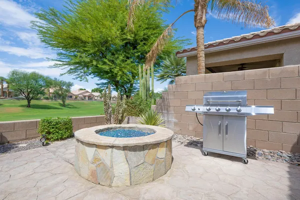 a view of a swimming pool with a patio