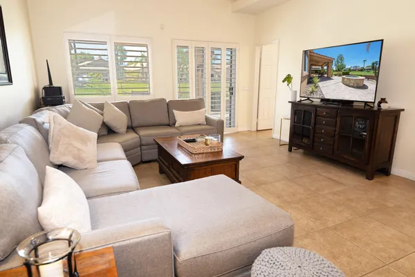 a living room with furniture and a flat screen tv