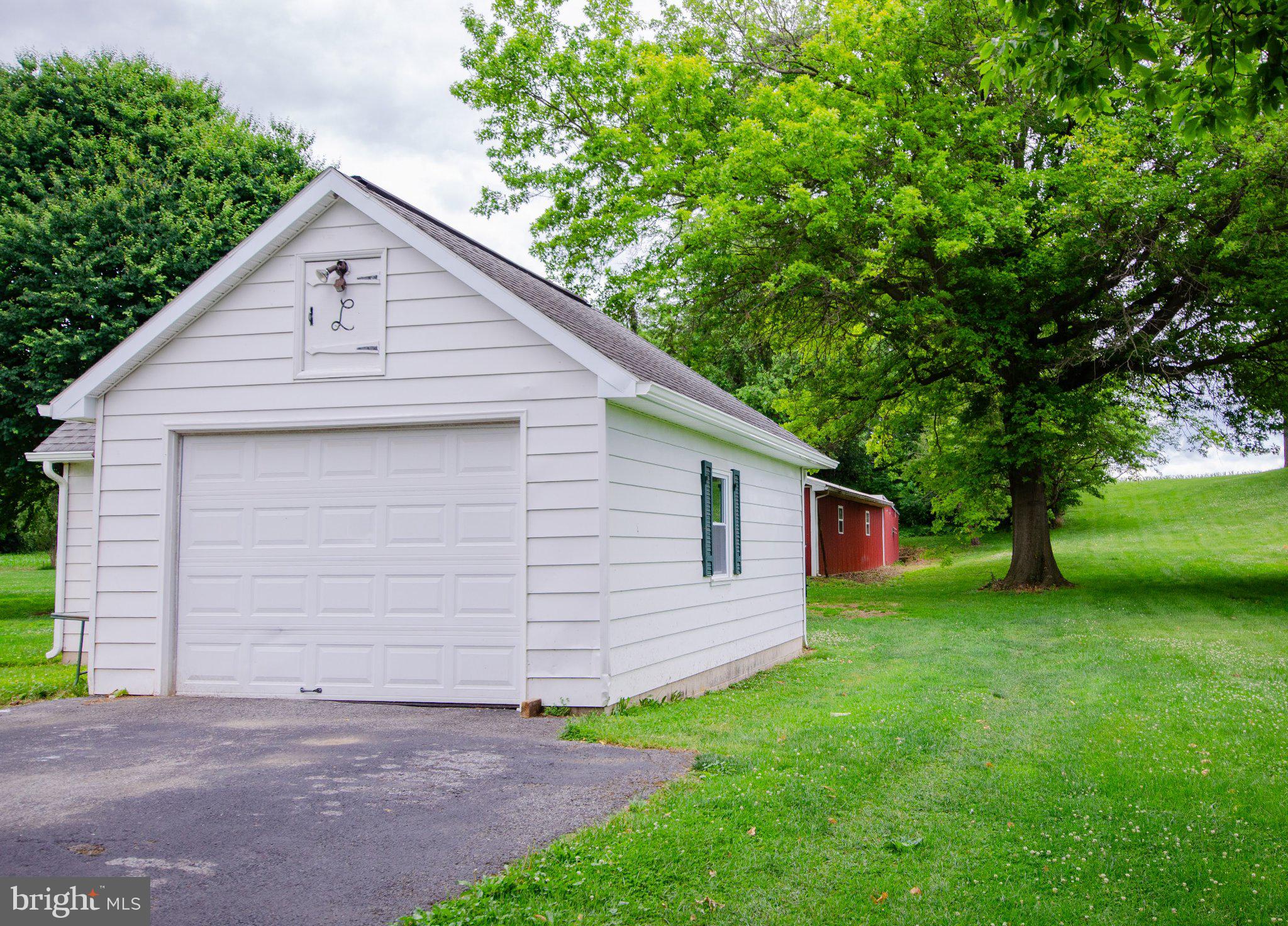 2615 Walnut Bottom Road Carlisle, PA 17015 - Photo 34 of 38 Charming garage amid lush greenery.