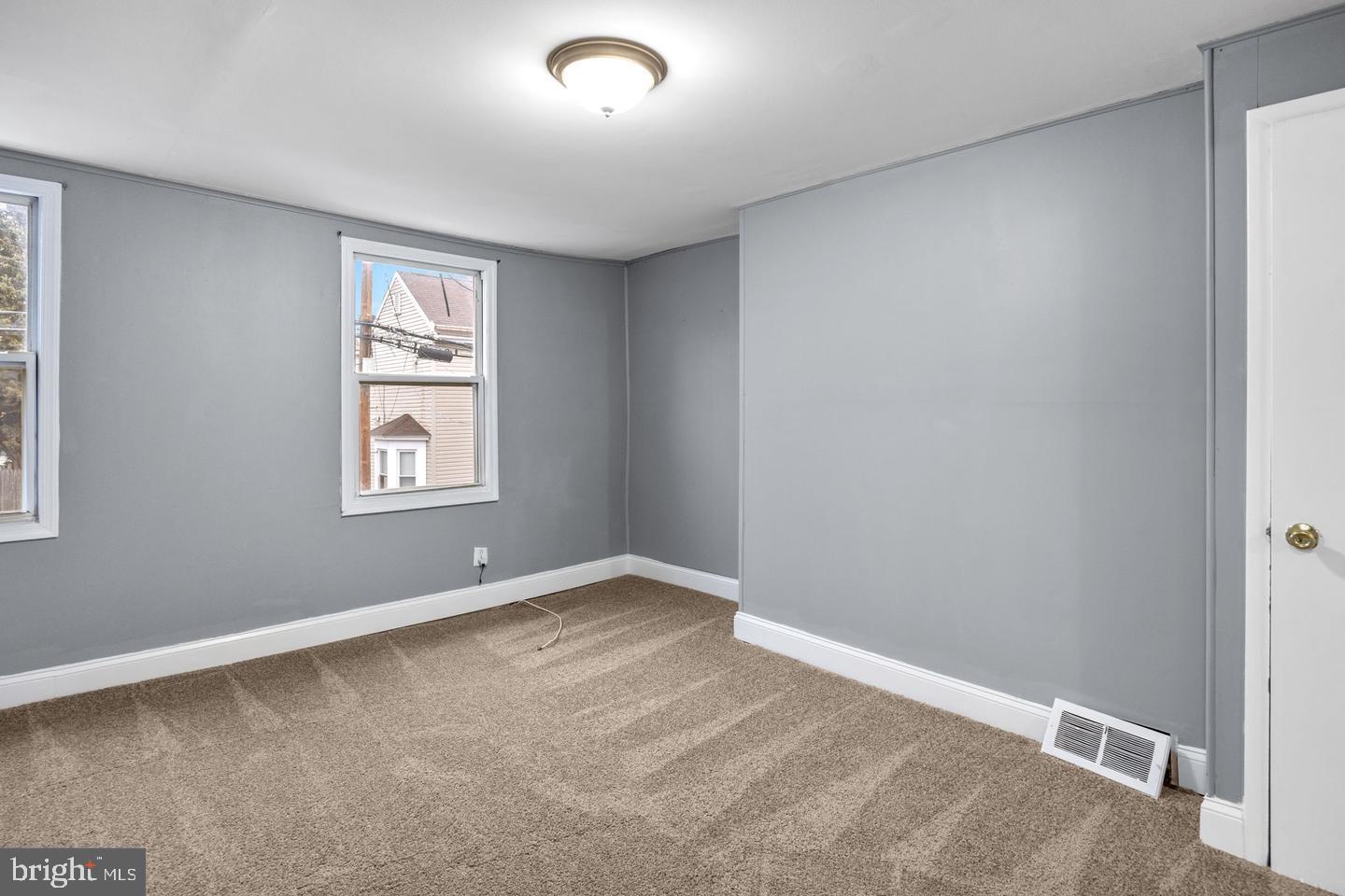 244 Cedar Street Bristol, PA 19007 - Photo 11 of 18 an empty room with windows